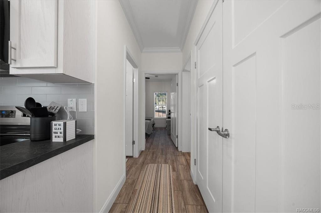 7962 West Riverbend Road Crystal River, FL 34428 - Photo 12 of 30 a view of a hallway with wooden floor and closet