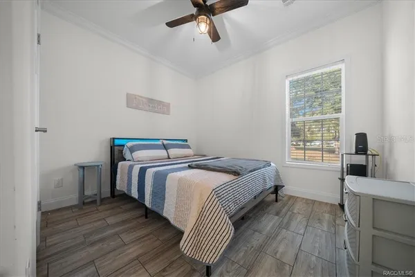 a bedroom with a bed and cabinets