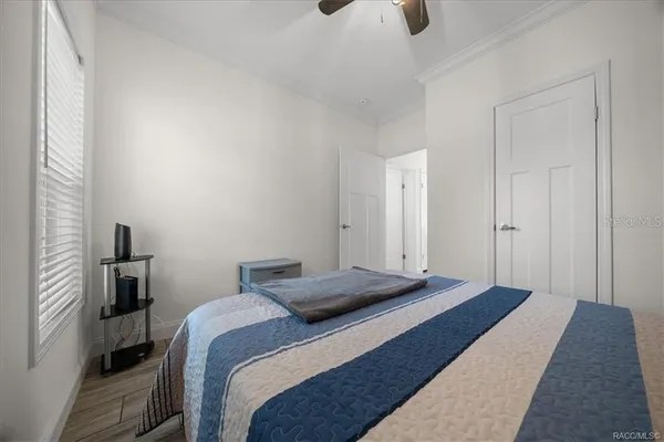 a bed room with a bed and a window