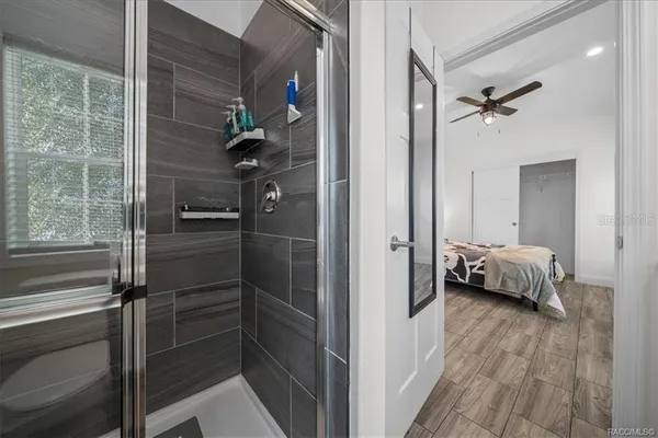 a bathroom with a glass shower door