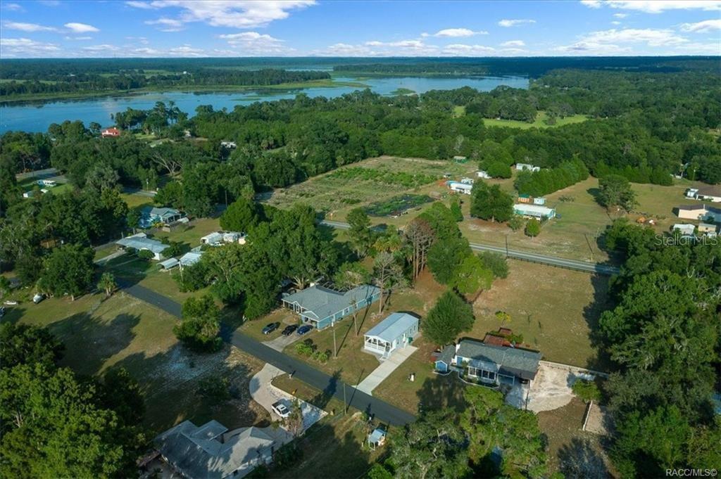 7962 West Riverbend Road Crystal River, FL 34428 - Photo 30 of 30 an aerial view of green landscape with trees houses and mountain view