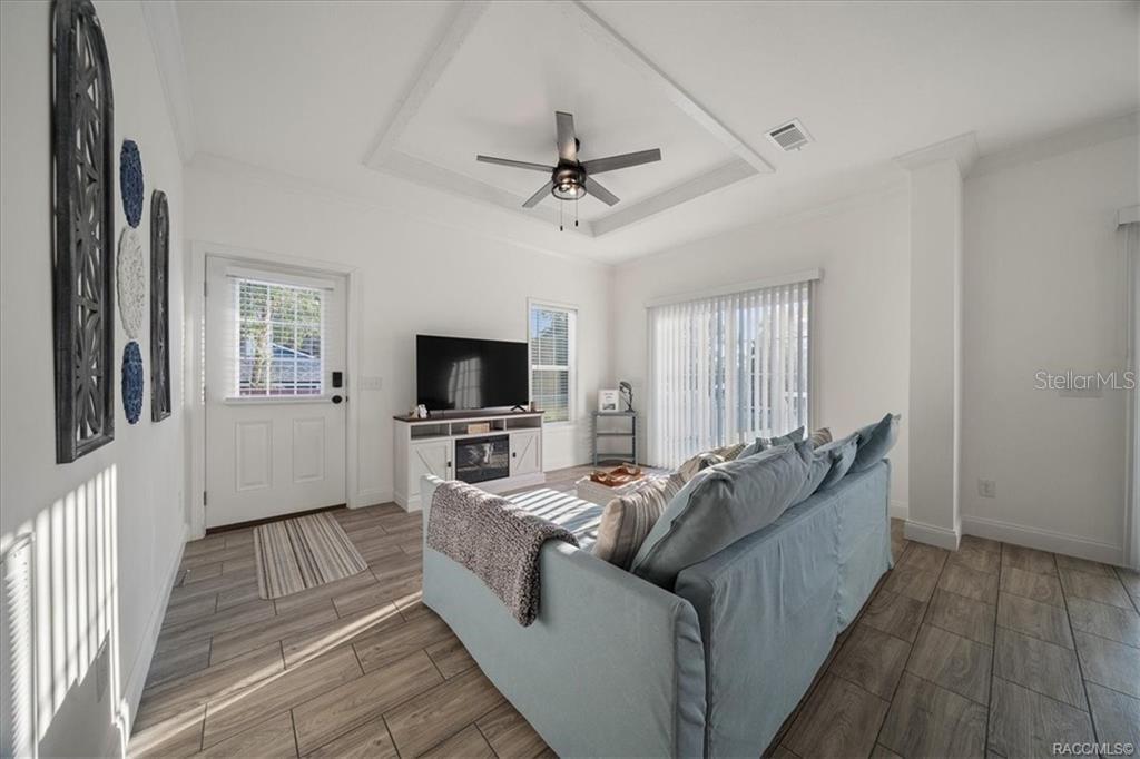 7962 West Riverbend Road Crystal River, FL 34428 - Photo 6 of 30 a living room with furniture and a flat screen tv