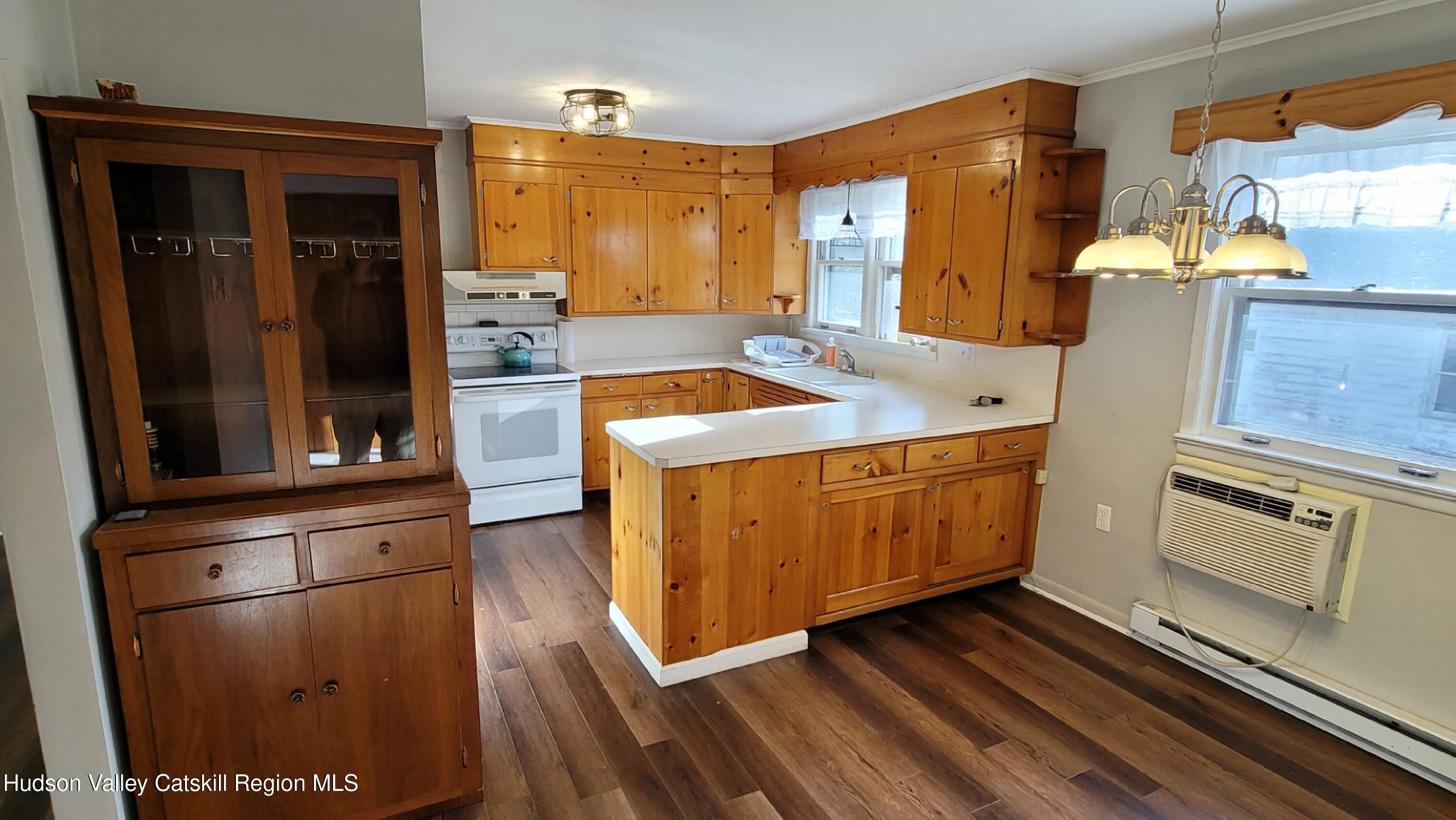 97 Ruby Road Kingston, NY 12401 - Photo 17 of 25 a kitchen with wooden cabinets and a stove top oven