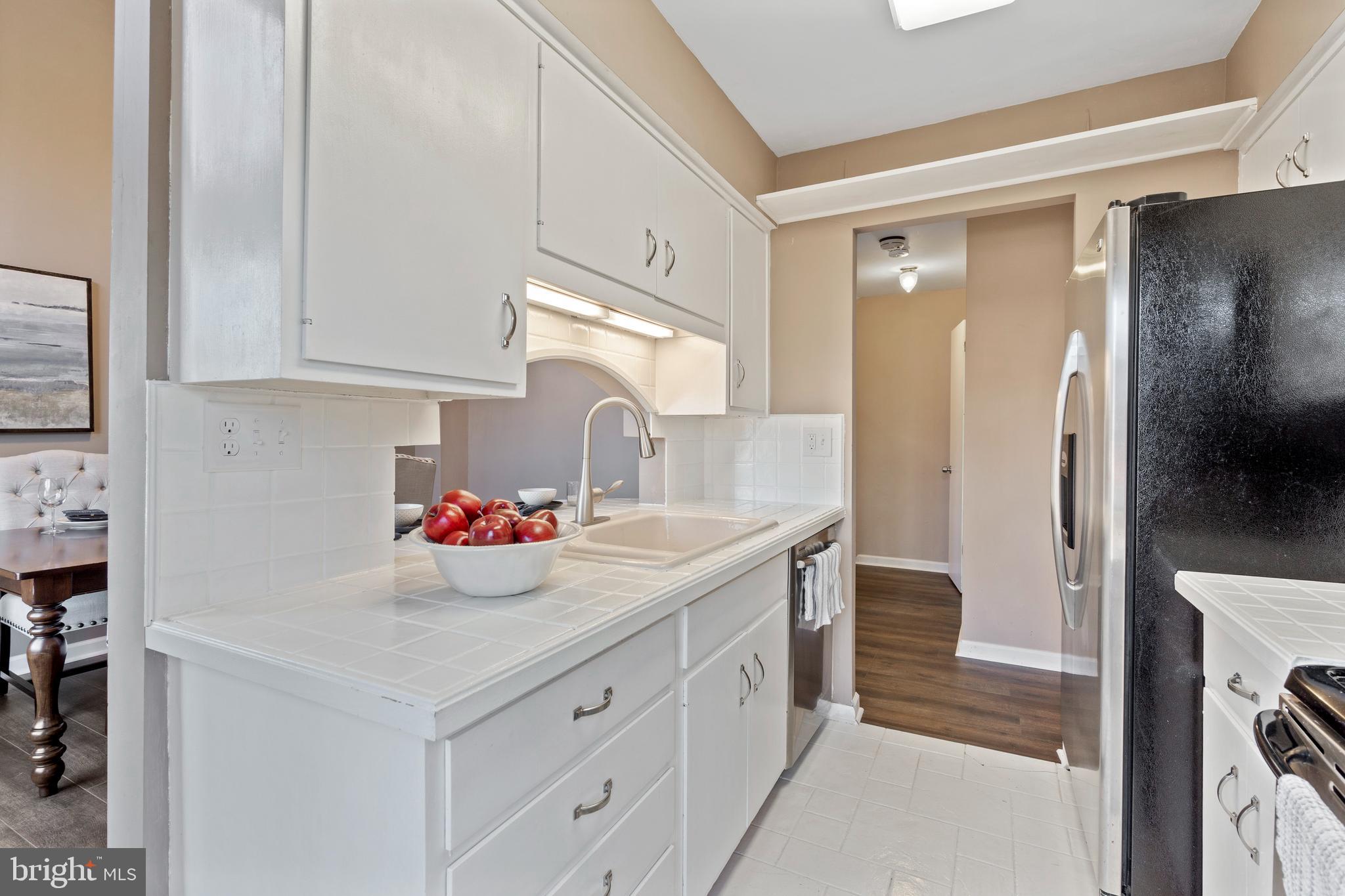 519 St Davids Road, Unit 3 Wayne, PA 19087 - Photo 15 of 31 a kitchen with a sink and cabinets