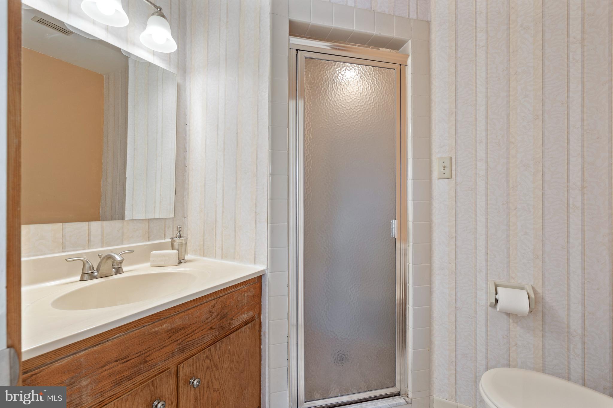 519 St Davids Road, Unit 3 Wayne, PA 19087 - Photo 20 of 31 a bathroom with a sink a toilet and shower
