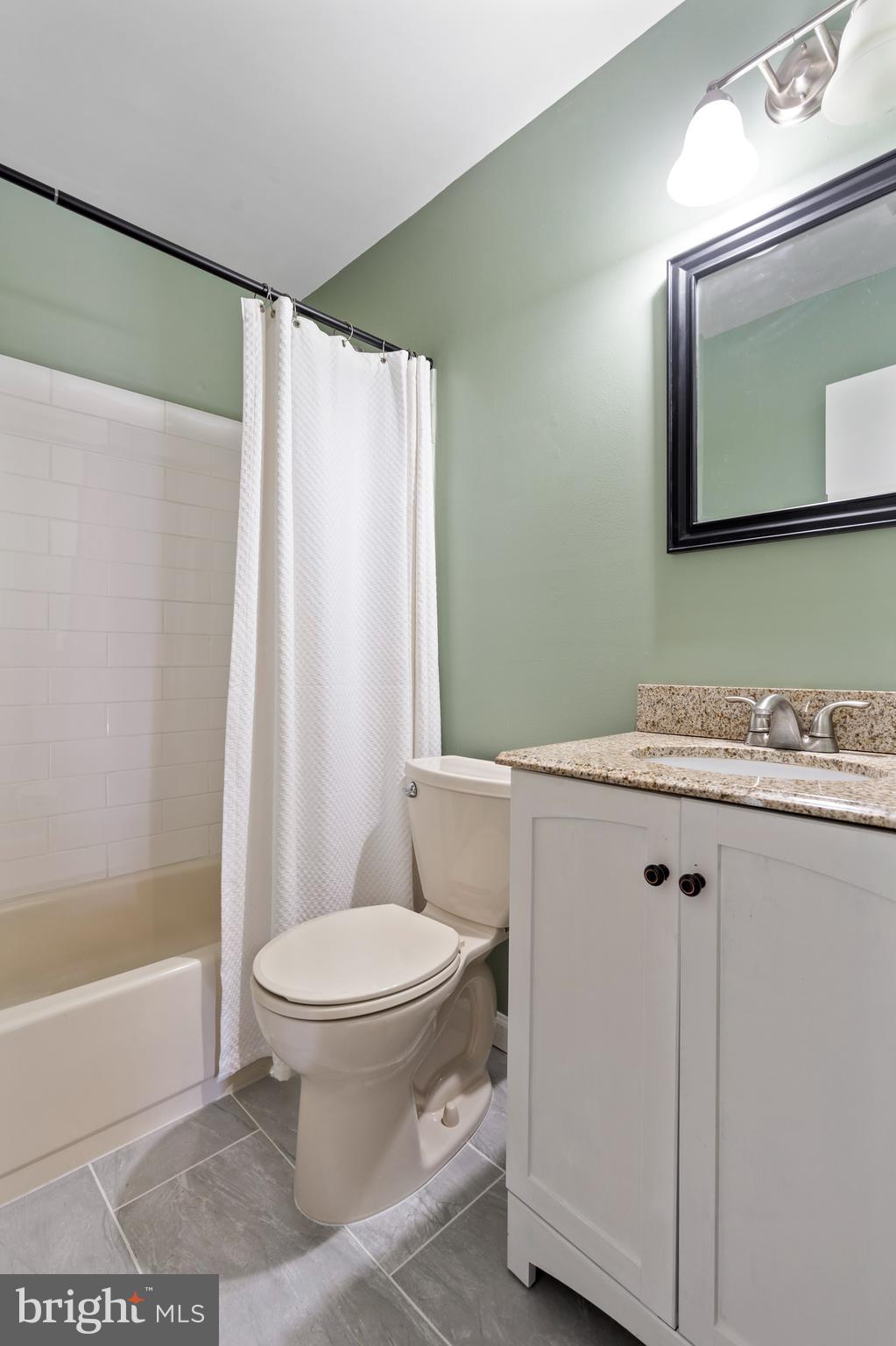 519 St Davids Road, Unit 3 Wayne, PA 19087 - Photo 23 of 31 a bathroom with a granite countertop sink toilet and shower