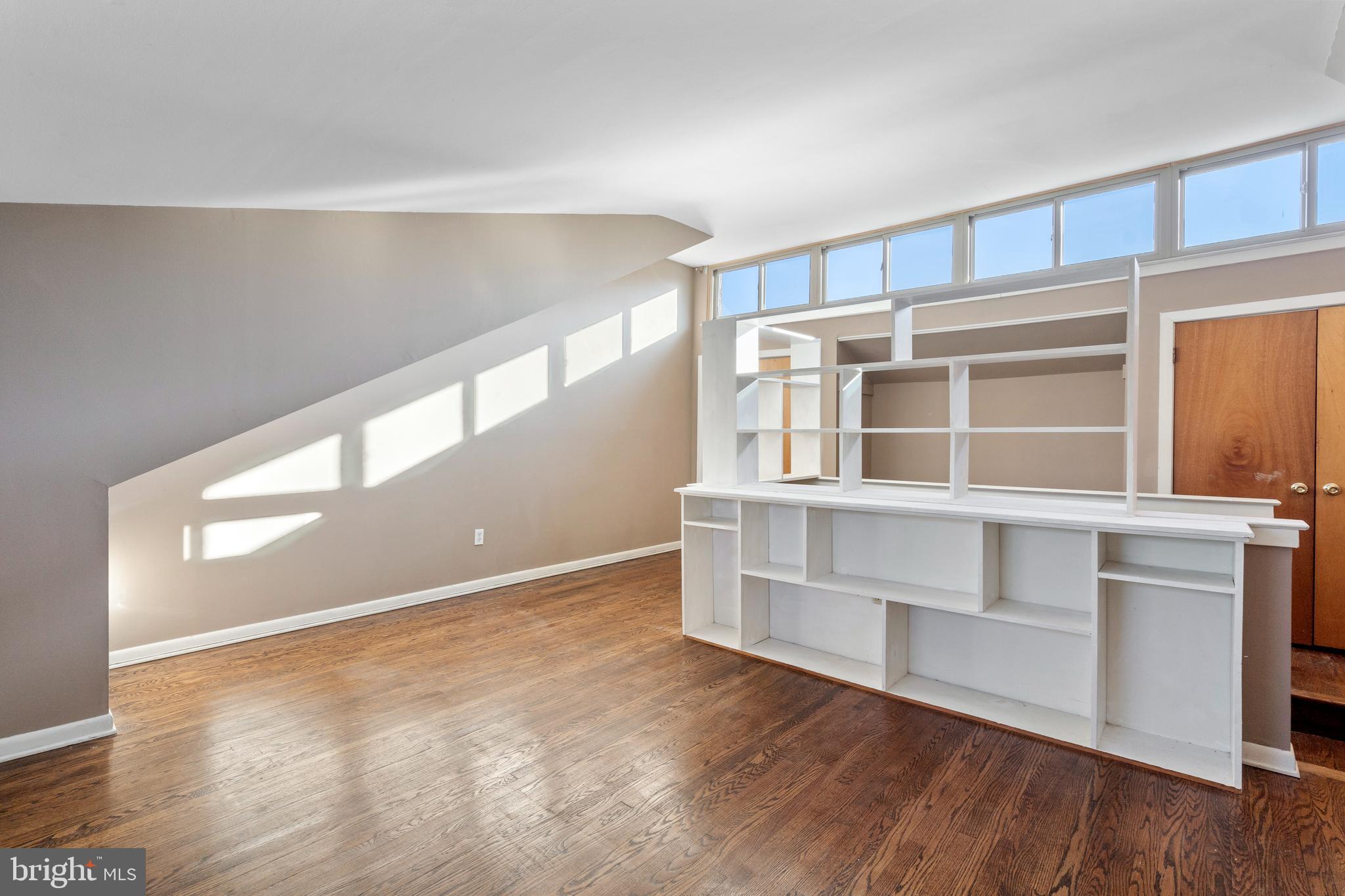 519 St Davids Road, Unit 3 Wayne, PA 19087 - Photo 25 of 31 a view of an empty room with wooden floor and a window