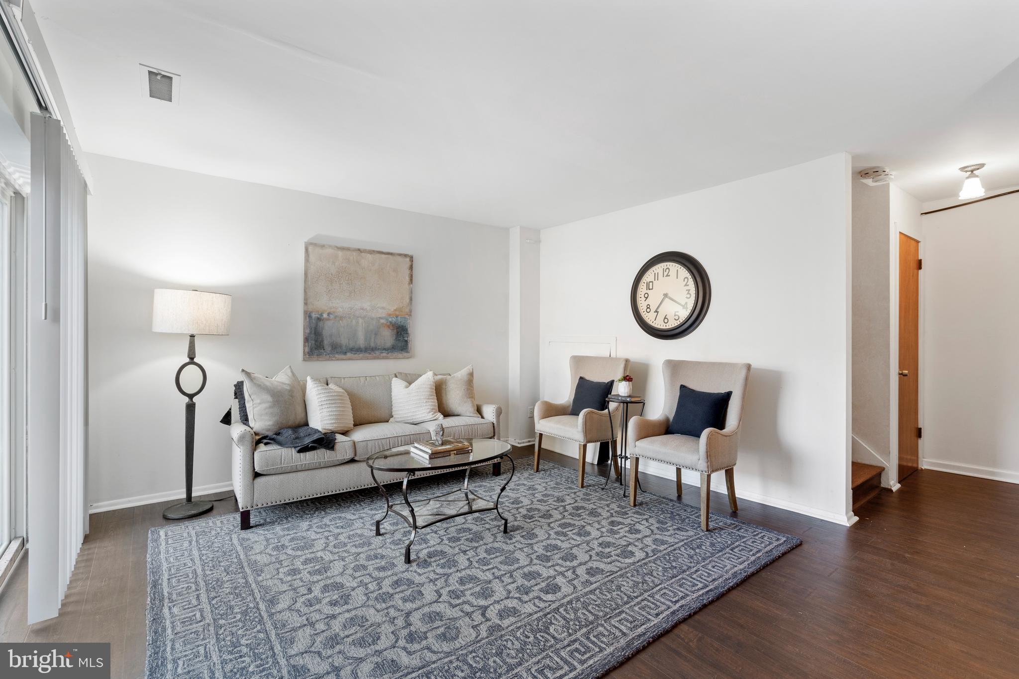 519 St Davids Road, Unit 3 Wayne, PA 19087 - Photo 28 of 31 a living room with furniture and wooden floor