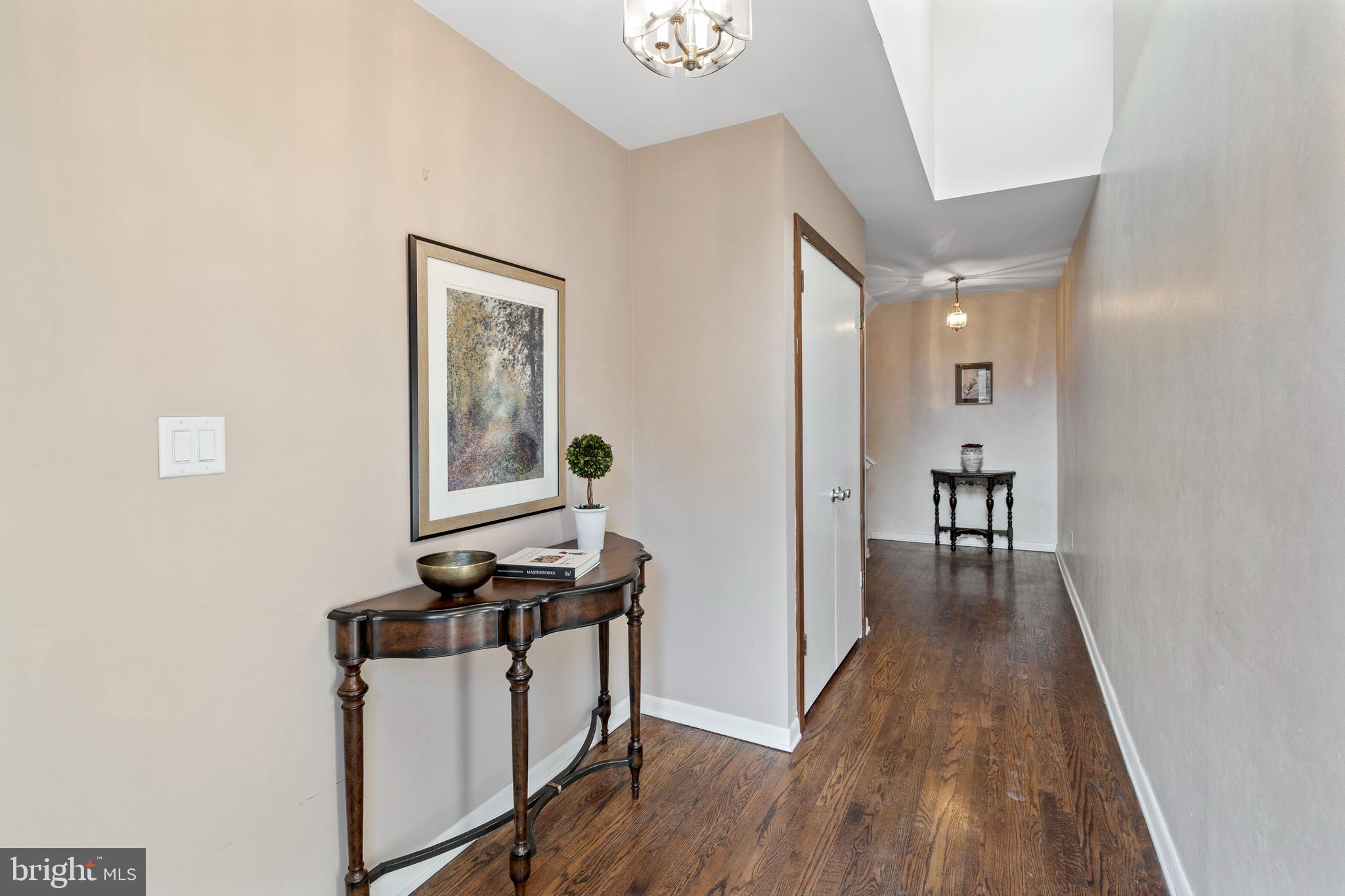 519 St Davids Road, Unit 3 Wayne, PA 19087 - Photo 3 of 31 a view of a hallway with wooden floor and a bathroom
