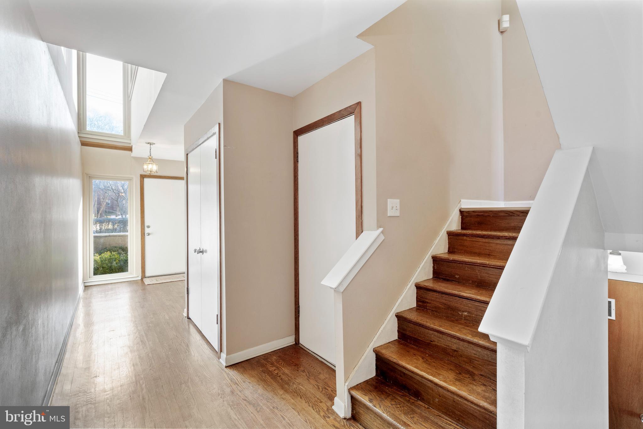 519 St Davids Road, Unit 3 Wayne, PA 19087 - Photo 4 of 31 a view of entryway with wooden floor and stairs