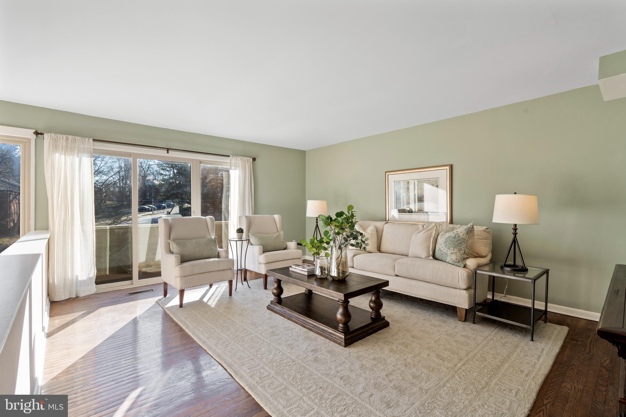 519 St Davids Road, Unit 3 Wayne, PA 19087 - Photo 5 of 31 a living room with furniture and a lamp on table with wooden floor