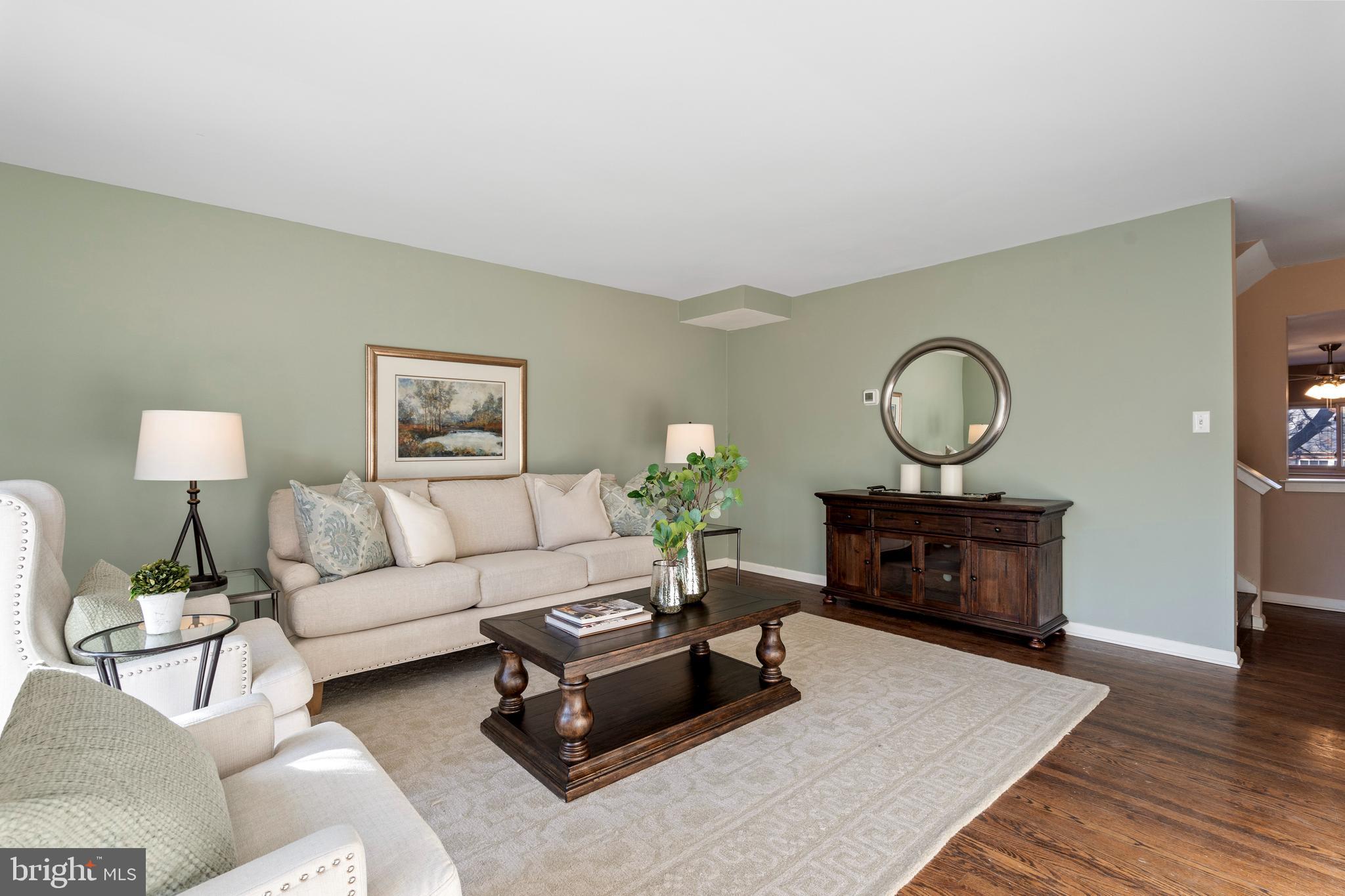 519 St Davids Road, Unit 3 Wayne, PA 19087 - Photo 6 of 31 a living room with furniture fireplace and wooden floor