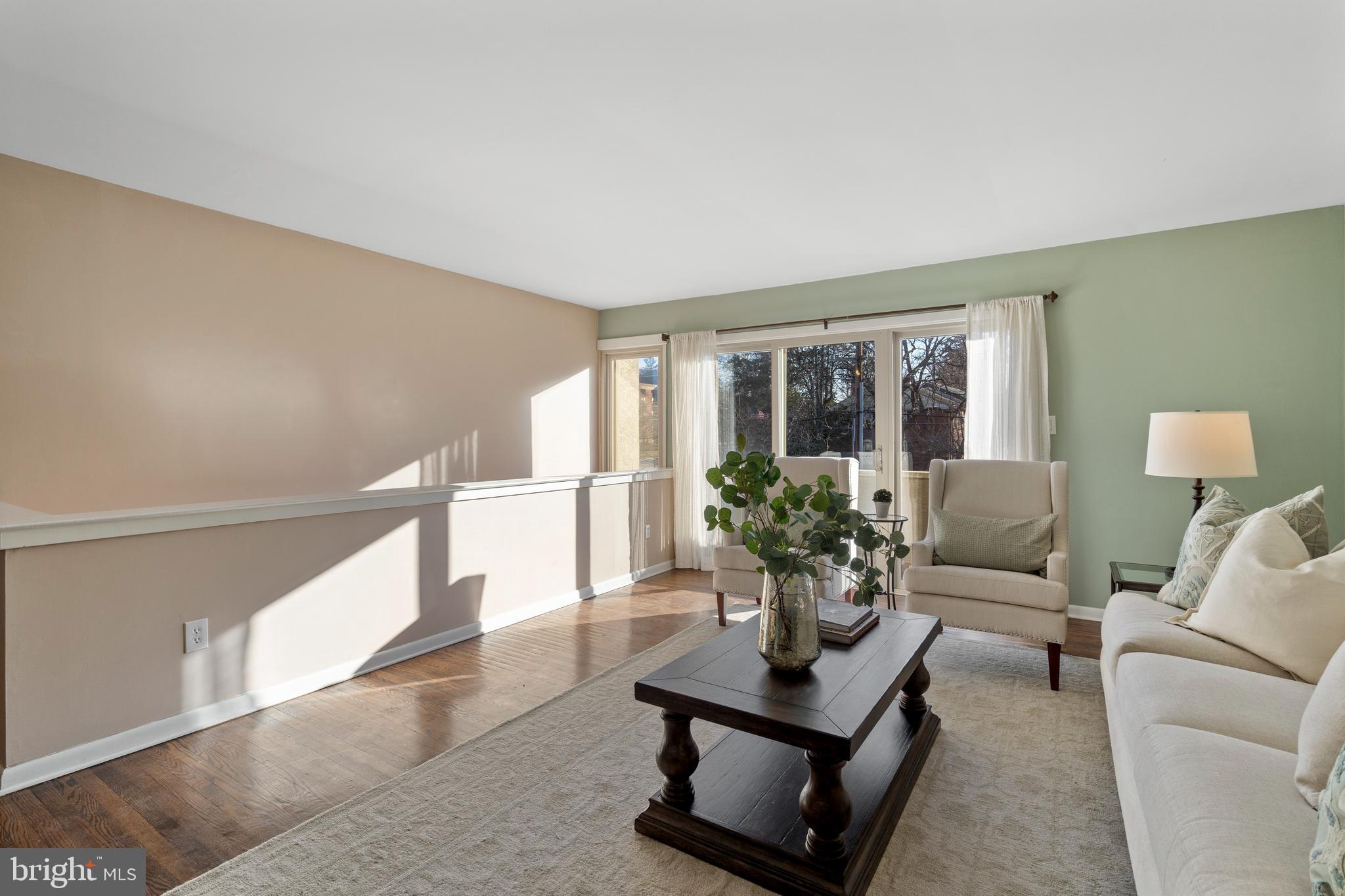 519 St Davids Road, Unit 3 Wayne, PA 19087 - Photo 7 of 31 a living room with furniture potted plant and a chandelier