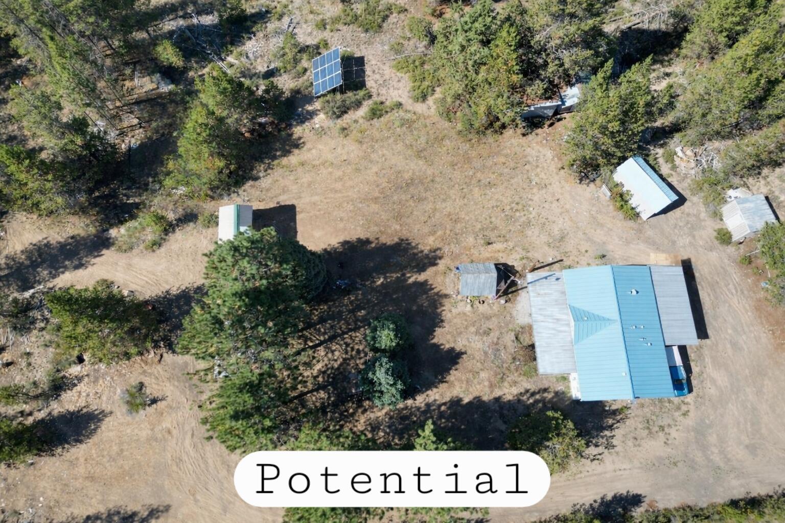 an aerial view of house with yard