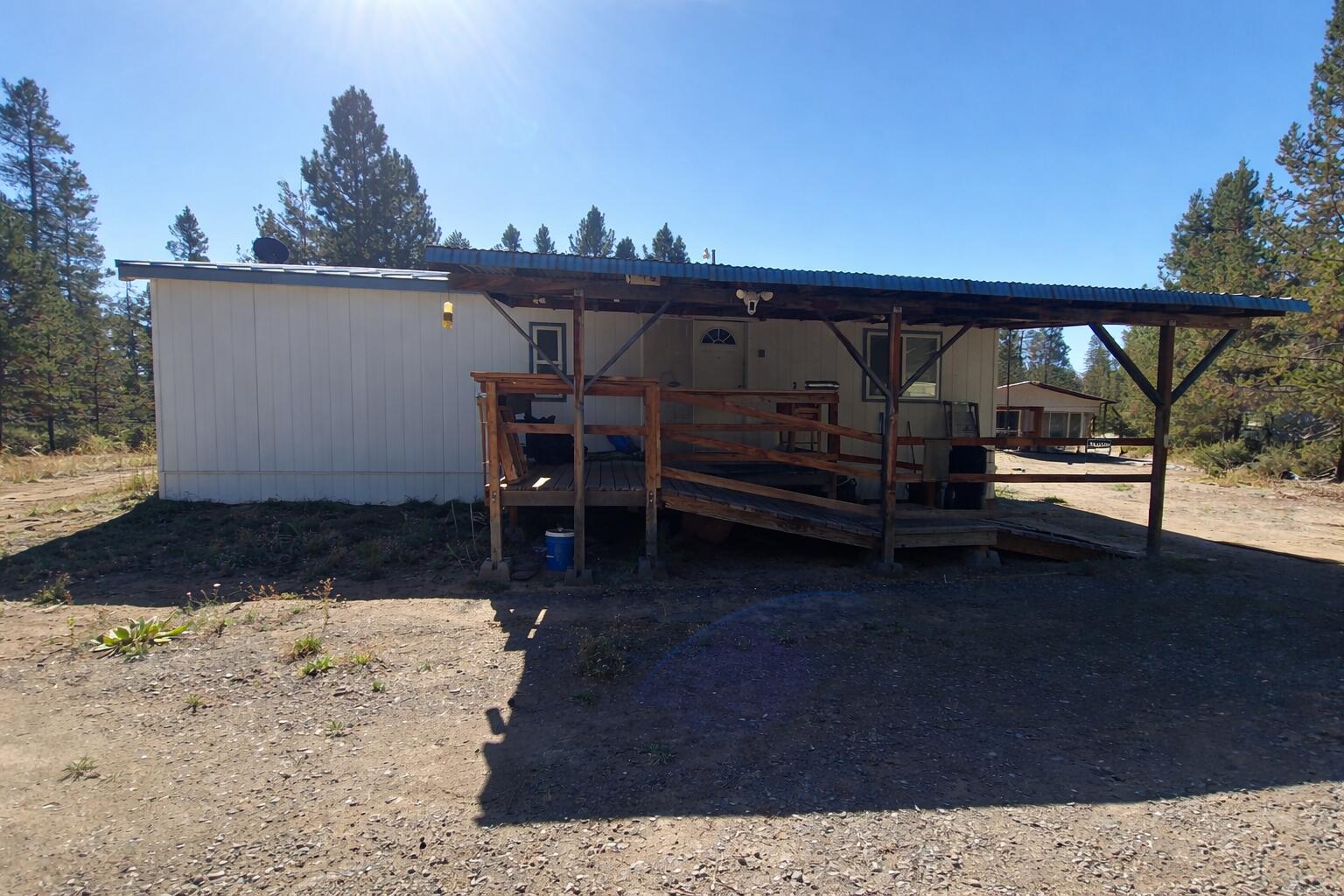 16395 Dawn Road La Pine, OR 97739 - Photo 5 of 33 a view of a roof deck with wooden floor and fence