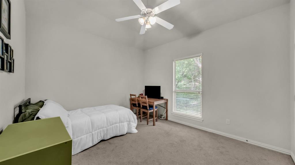 203 Mockingbird Lane Aledo, TX 76008 - Photo 32 of 37 Carpeted interior space with a window, ceiling fan, and white baseboards