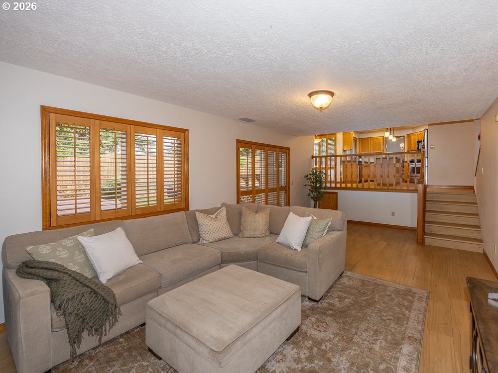 1811 Northwest 19th Street Gresham, OR 97030 - Photo 13 of 39 a living room with furniture and a large window