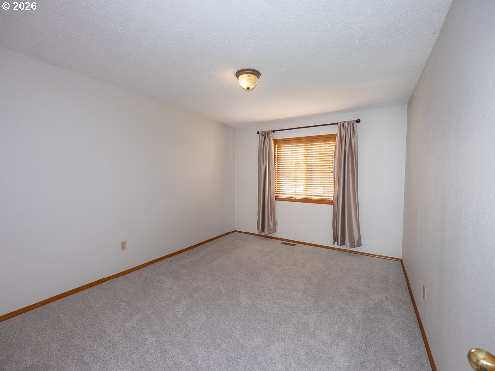 1811 Northwest 19th Street Gresham, OR 97030 - Photo 25 of 39 a view of an empty room with a window