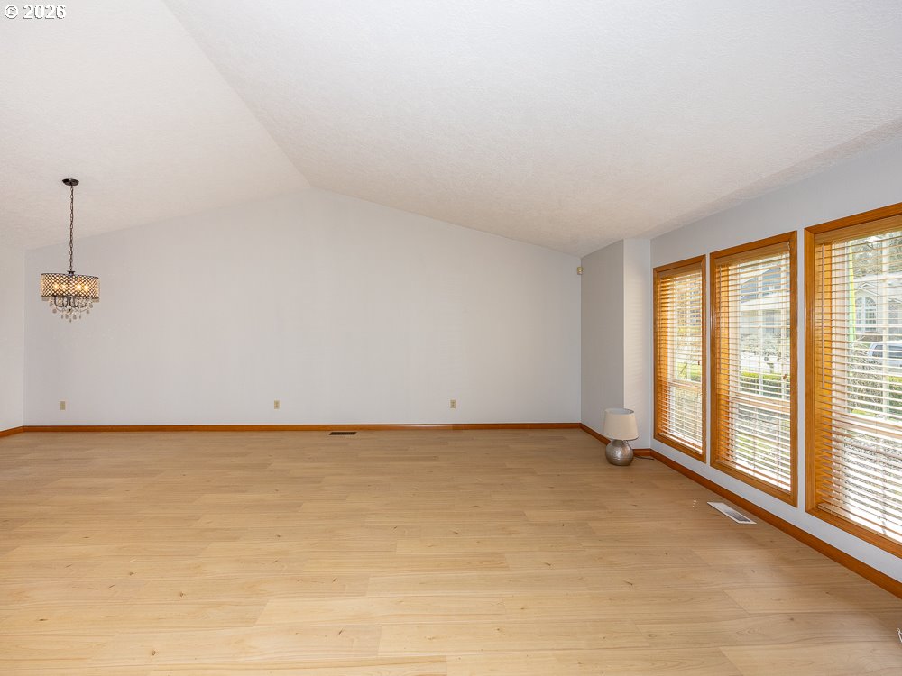 1811 Northwest 19th Street Gresham, OR 97030 - Photo 4 of 39 a view of an empty room with a window