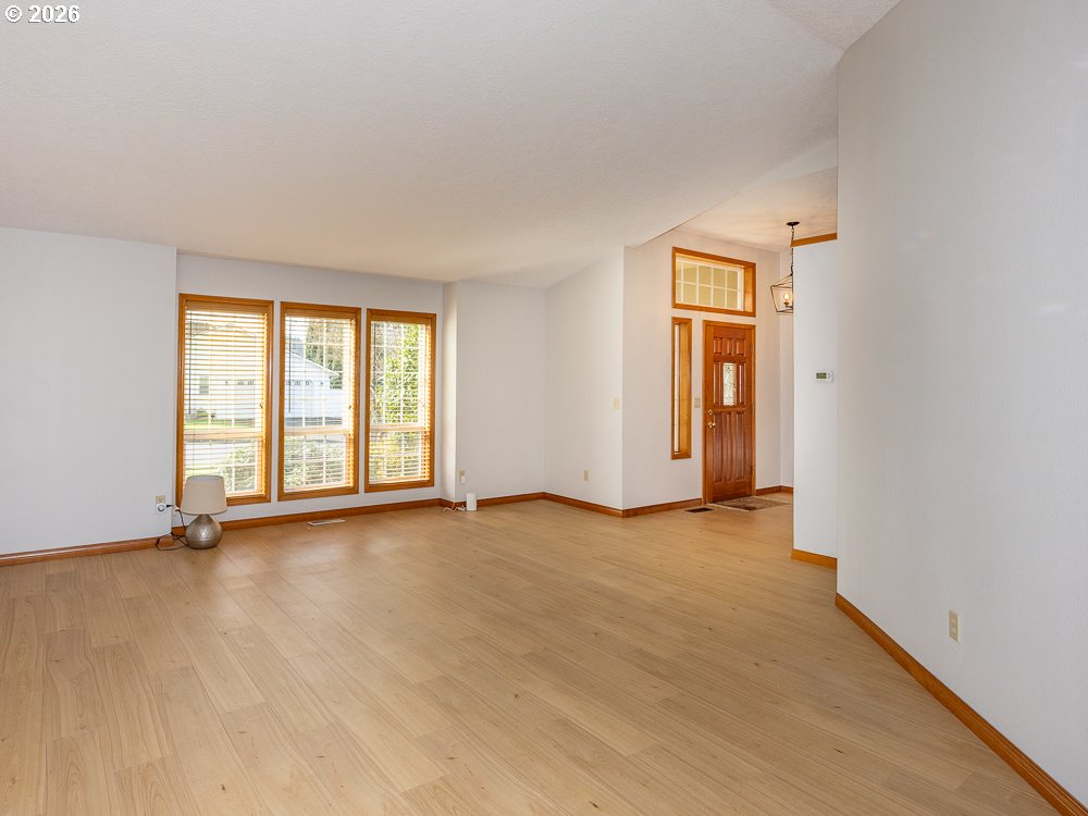 1811 Northwest 19th Street Gresham, OR 97030 - Photo 6 of 39 an empty room with windows and closet