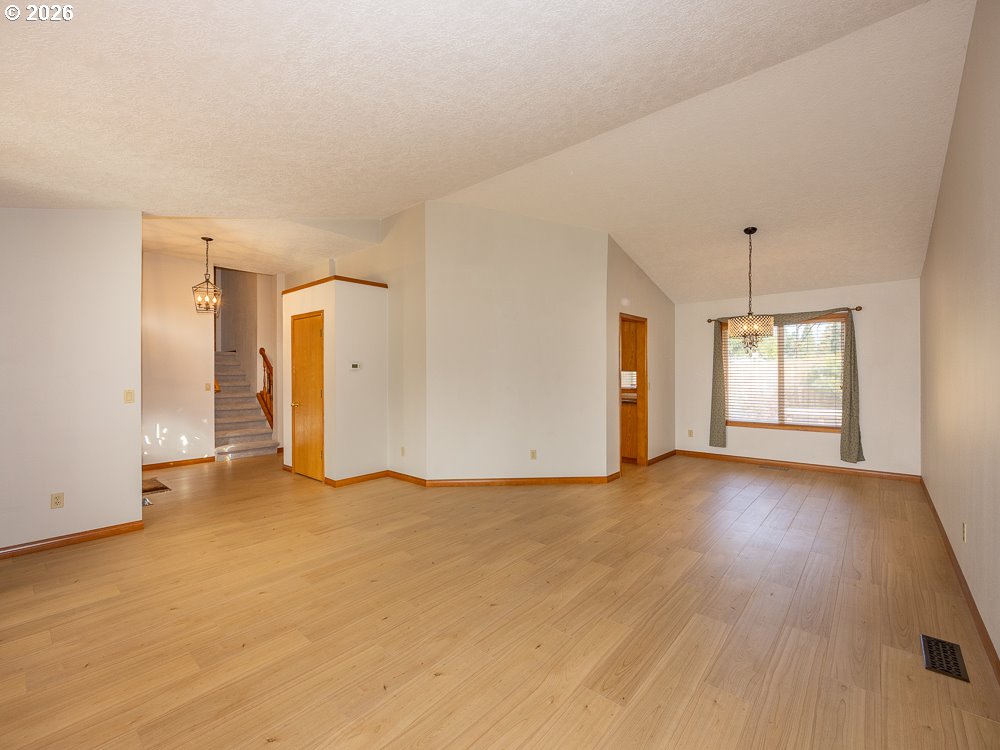 1811 Northwest 19th Street Gresham, OR 97030 - Photo 8 of 39 a view of empty room with wooden floor and window