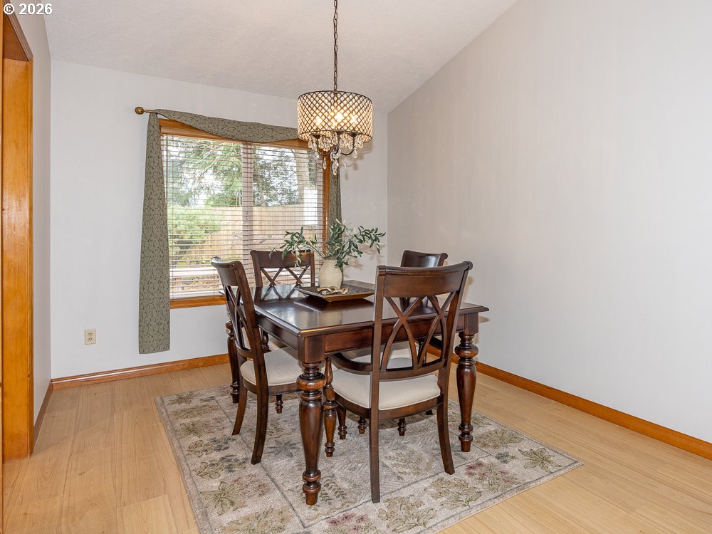 1811 Northwest 19th Street Gresham, OR 97030 - Photo 9 of 39 a view of a dining room with furniture window and wooden floor