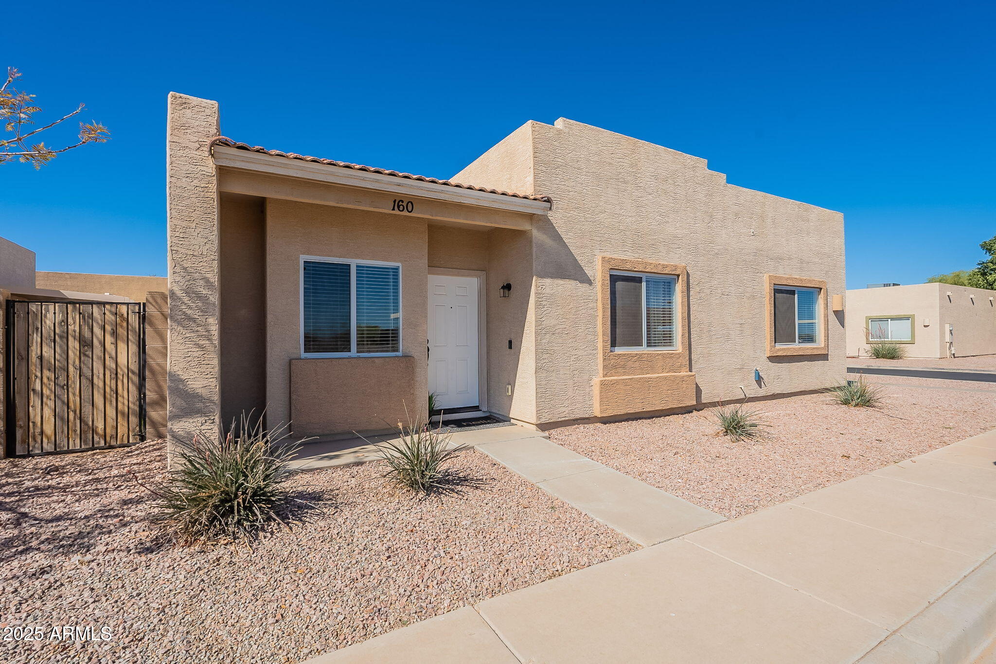 2300 East Magma Road, Unit 160 San Tan Valley, AZ 85143 - Photo 1 of 44 a backyard of a house