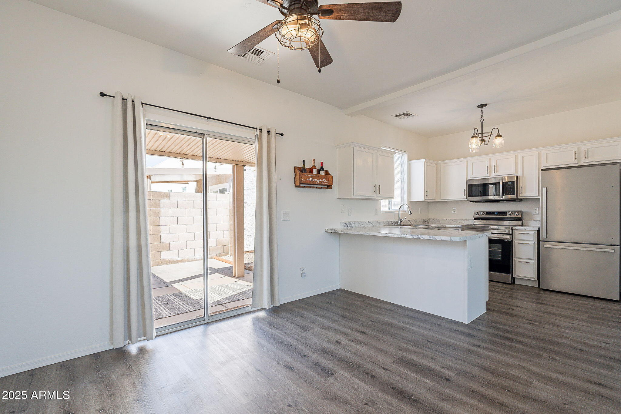 2300 East Magma Road, Unit 160 San Tan Valley, AZ 85143 - Photo 11 of 44 a kitchen with a refrigerator and white cabinets