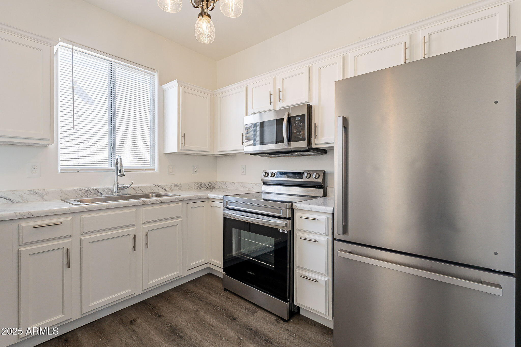 2300 East Magma Road, Unit 160 San Tan Valley, AZ 85143 - Photo 15 of 44 a kitchen with stainless steel appliances a refrigerator sink and microwave