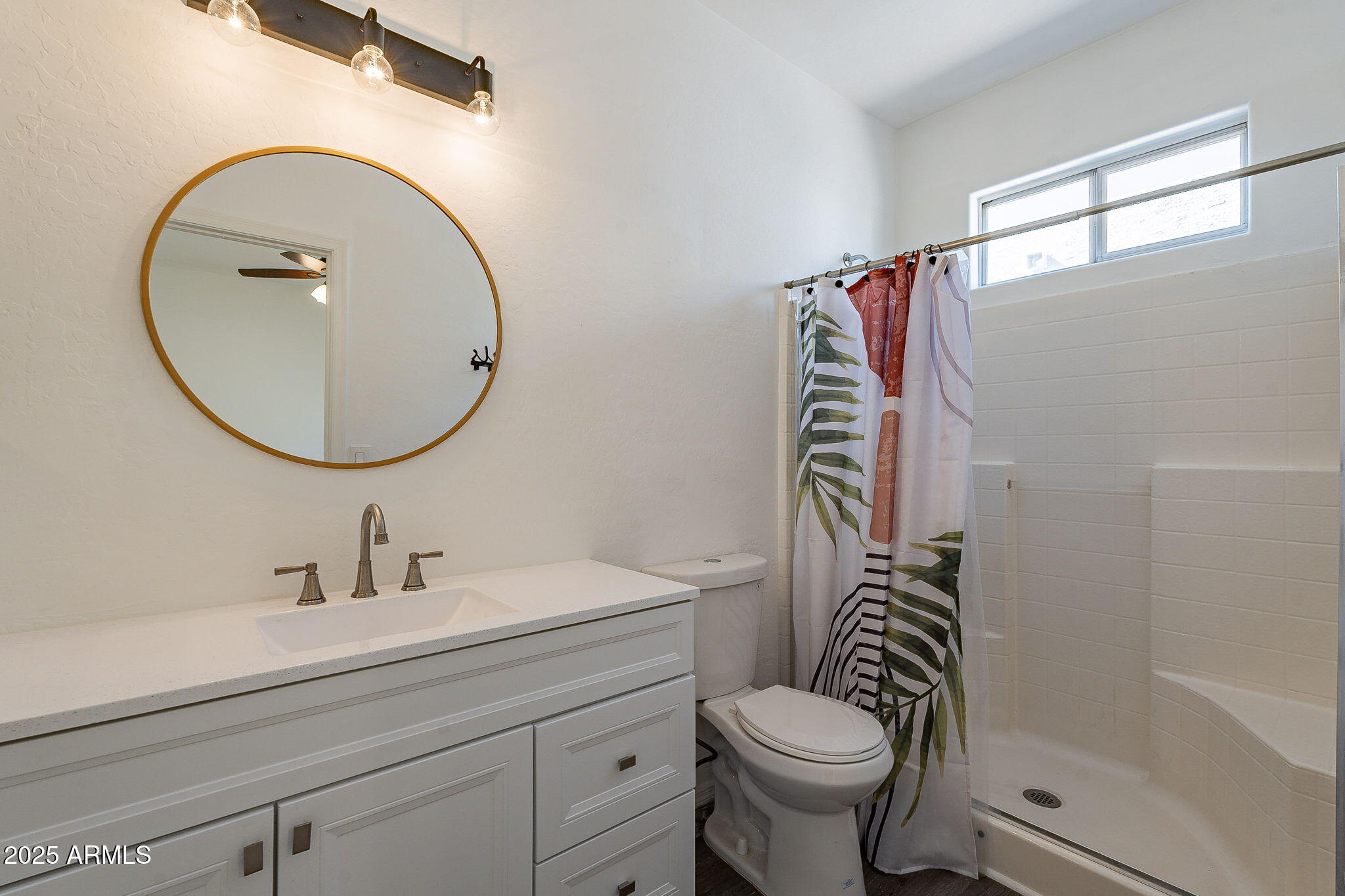 2300 East Magma Road, Unit 160 San Tan Valley, AZ 85143 - Photo 17 of 44 a bathroom with a sink a toilet and a mirror