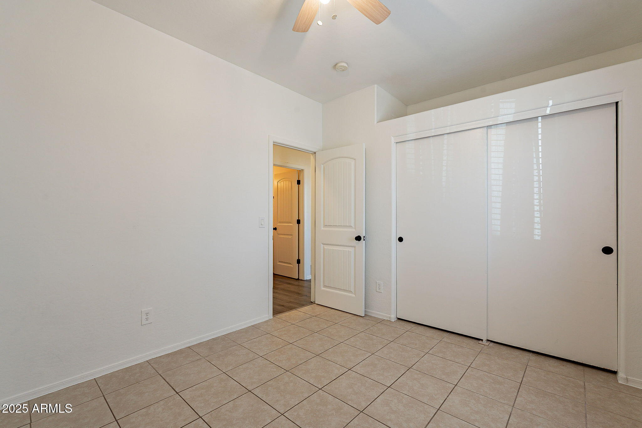 2300 East Magma Road, Unit 160 San Tan Valley, AZ 85143 - Photo 25 of 44 a view of a room with a chandelier fan and closet area