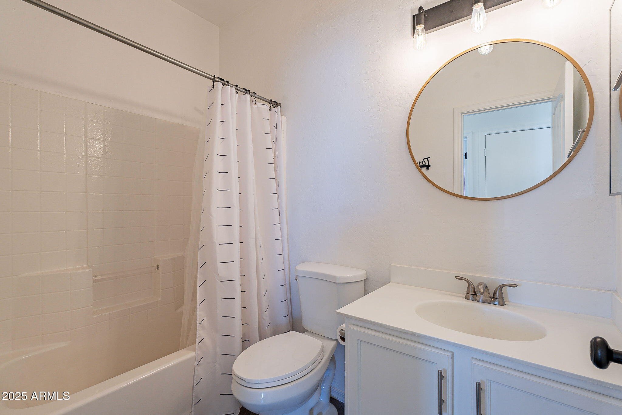 2300 East Magma Road, Unit 160 San Tan Valley, AZ 85143 - Photo 26 of 44 a bathroom with a toilet a sink and a mirror