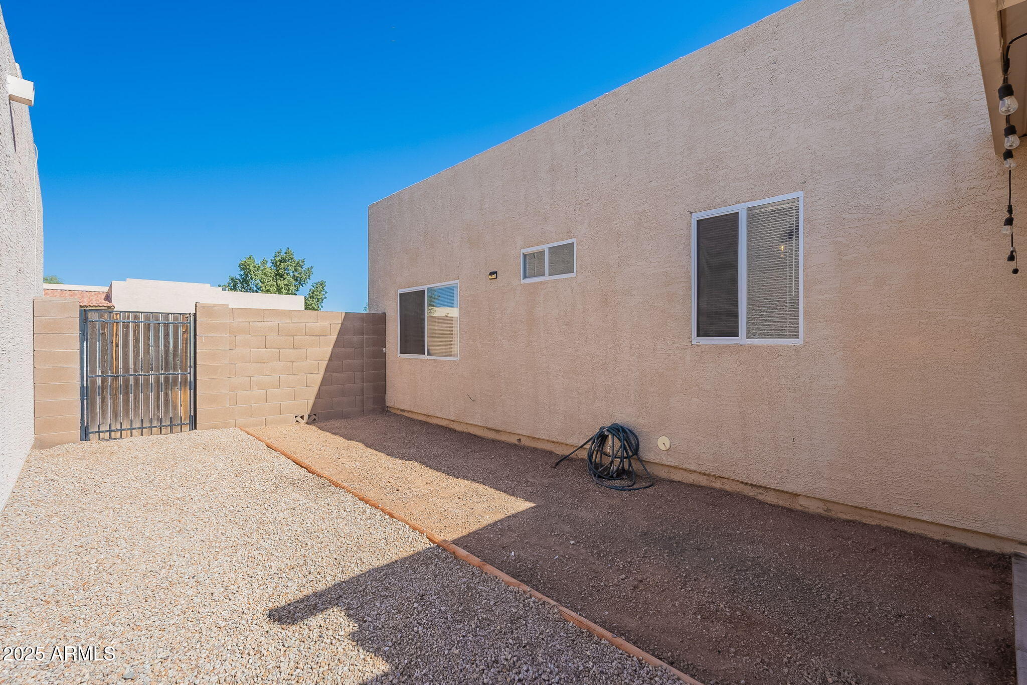 2300 East Magma Road, Unit 160 San Tan Valley, AZ 85143 - Photo 32 of 44 a view of backyard with furniture and windows