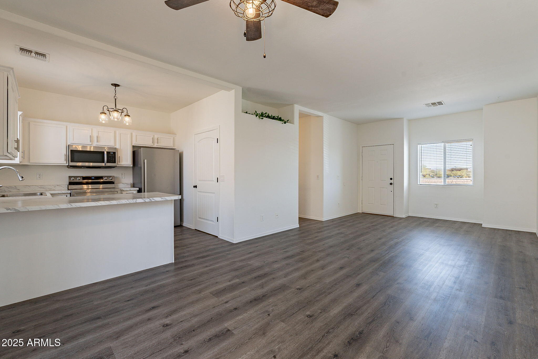 2300 East Magma Road, Unit 160 San Tan Valley, AZ 85143 - Photo 5 of 44 a view of kitchen with sink microwave and stove