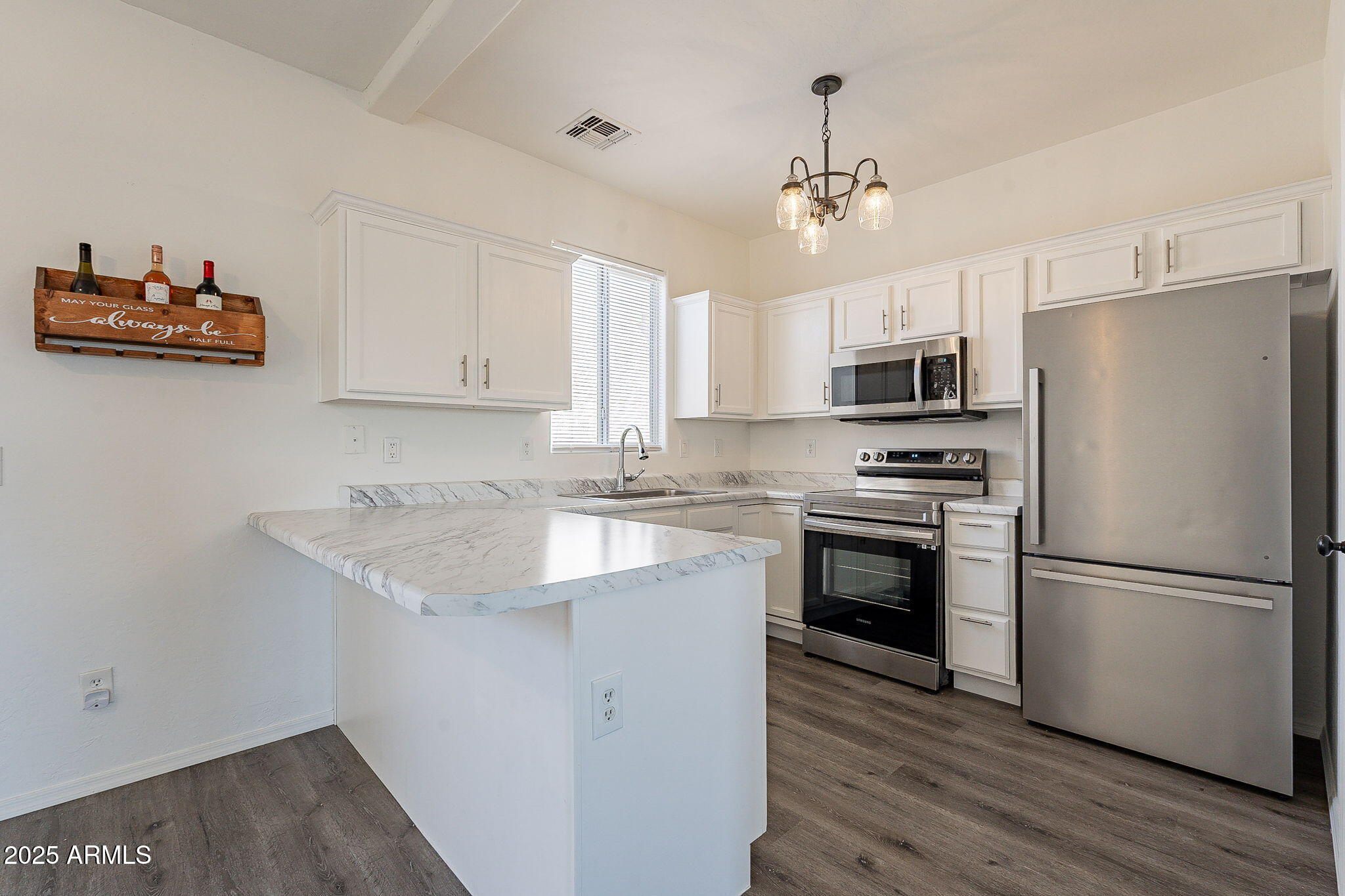 2300 East Magma Road, Unit 160 San Tan Valley, AZ 85143 - Photo 9 of 44 a kitchen with kitchen island granite countertop a refrigerator stove and microwave