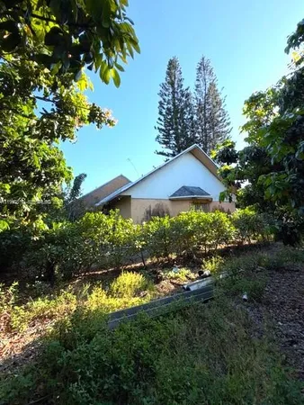 a view of a house with garden