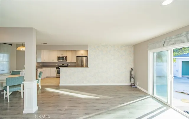 a view of kitchen living room with wooden floor