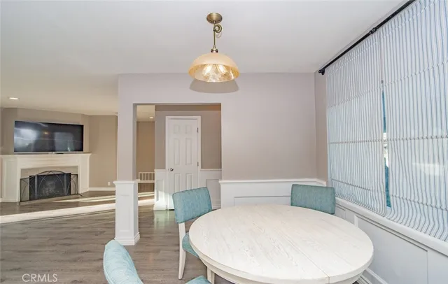 a bathroom with a sink a toilet and a fireplace