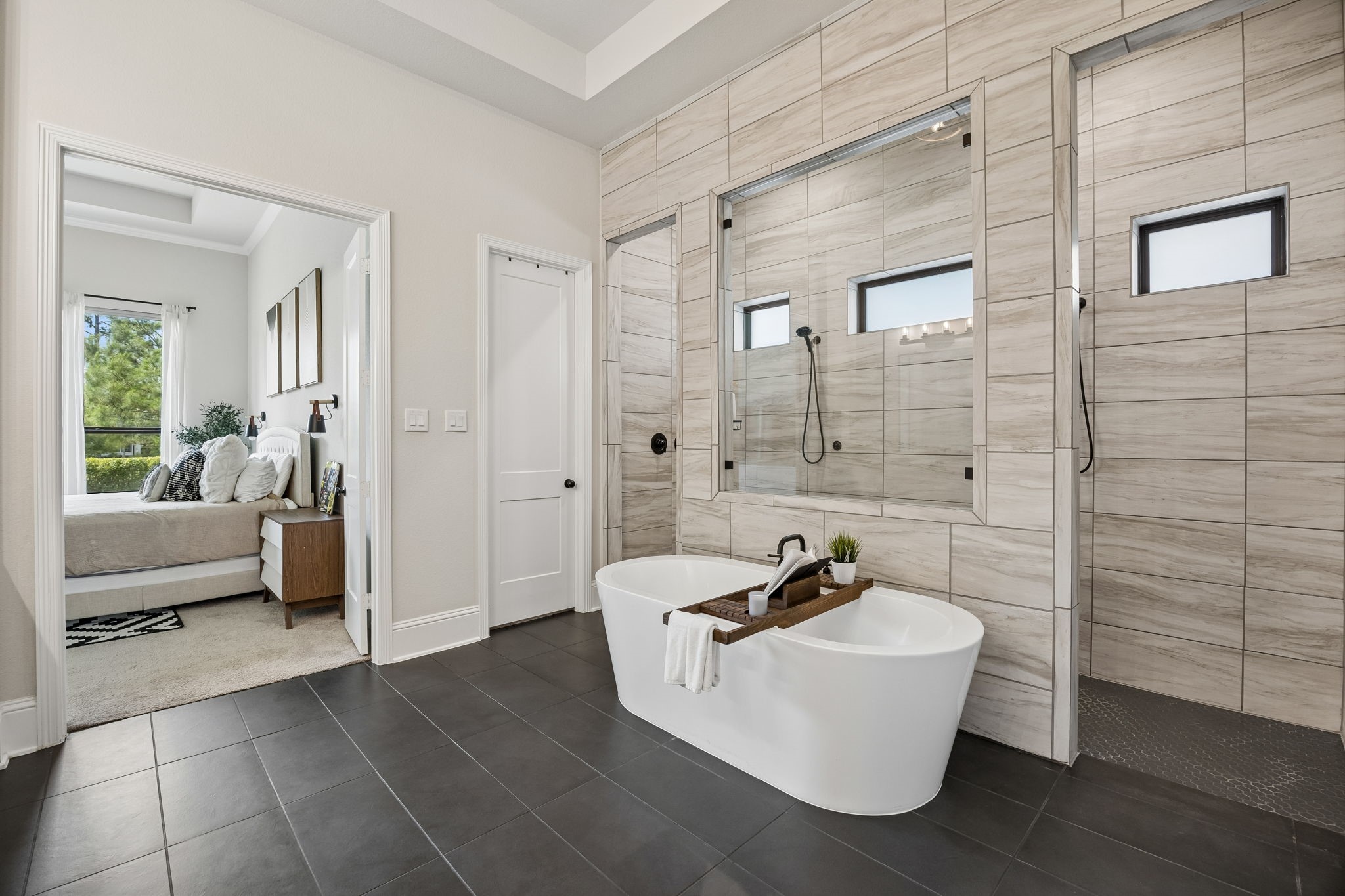 10102 South Goshawk Trail Conroe, TX 77385 - Photo 14 of 46 a bathroom with a sink a mirror and a shower