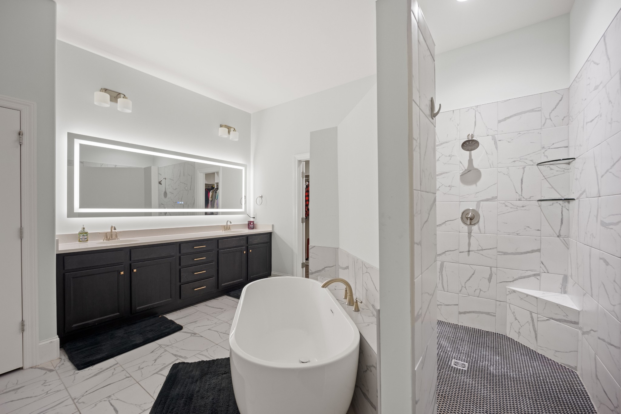 1008 Quillen Way Lebanon, TN 37087 - Photo 15 of 45 a spacious bathroom with a double vanity sink toilet mirror and bathtub
