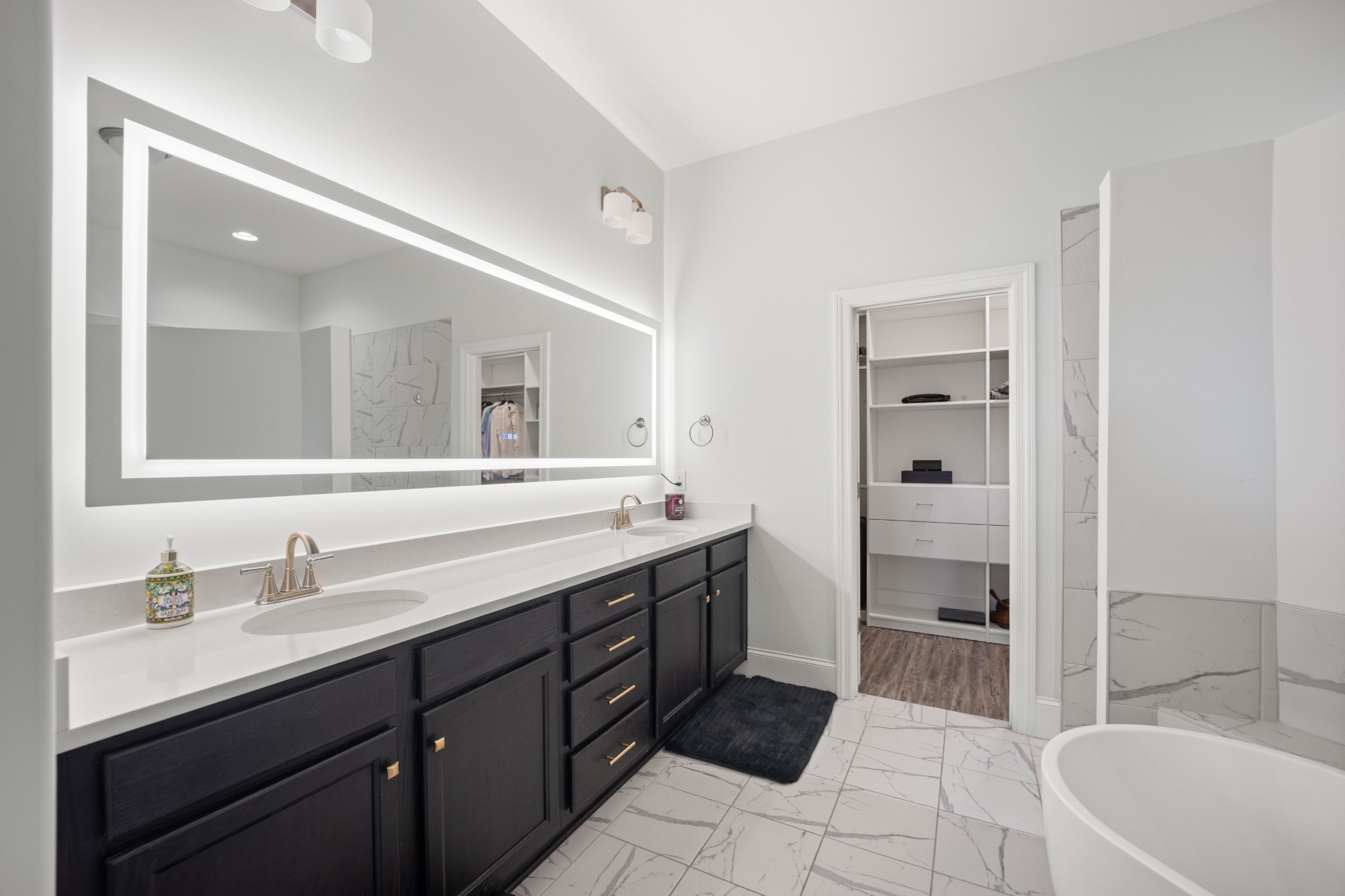 1008 Quillen Way Lebanon, TN 37087 - Photo 18 of 45 a spacious bathroom with a tub sink double vanity and a mirror