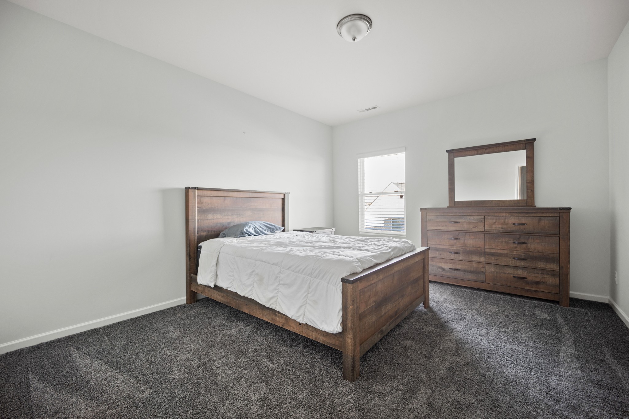 1008 Quillen Way Lebanon, TN 37087 - Photo 31 of 45 a bedroom with a bed and a dresser