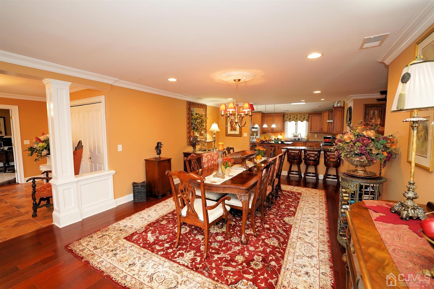 56 Kingsley Road Kendall Park, NJ 08824 - Photo 11 of 62 a living room with lots of furniture and wooden floor