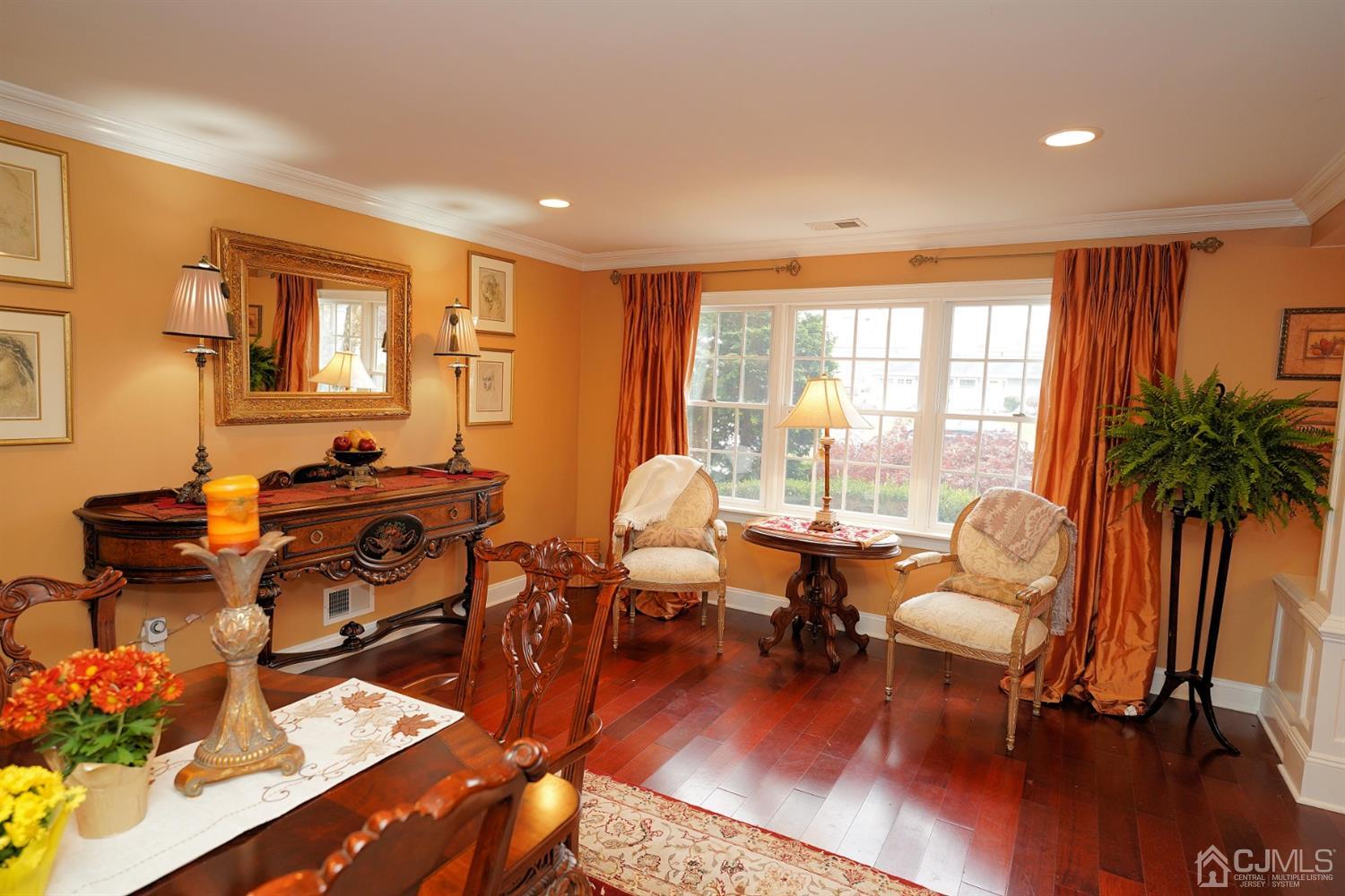 56 Kingsley Road Kendall Park, NJ 08824 - Photo 12 of 62 a living room with furniture hard wood floor and a floor to ceiling window