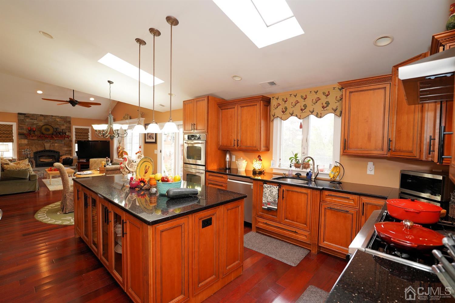 56 Kingsley Road Kendall Park, NJ 08824 - Photo 17 of 62 a kitchen with stainless steel appliances granite countertop a stove a sink dishwasher and a refrigerator
