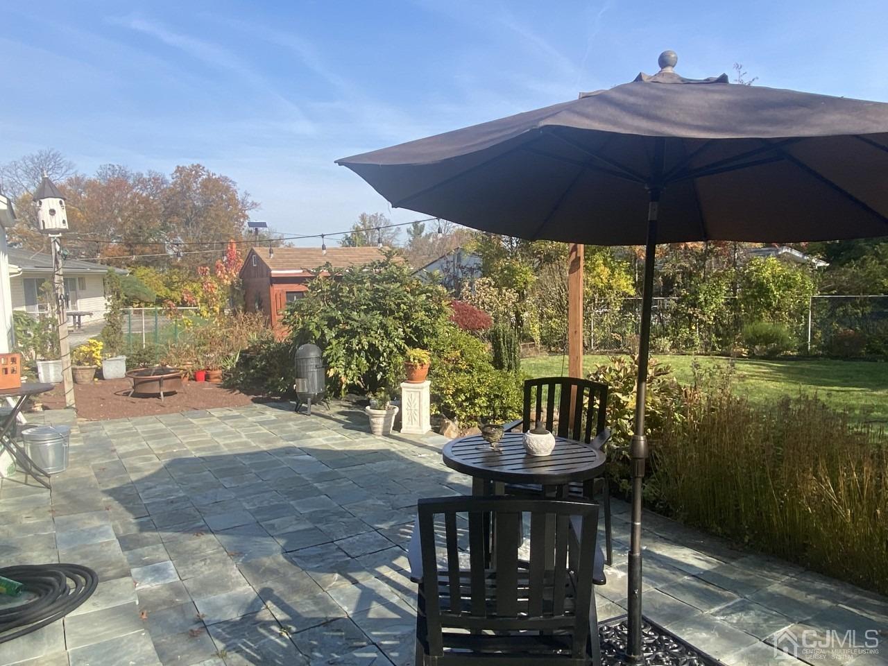 56 Kingsley Road Kendall Park, NJ 08824 - Photo 3 of 62 a view of outdoor space yard and patio