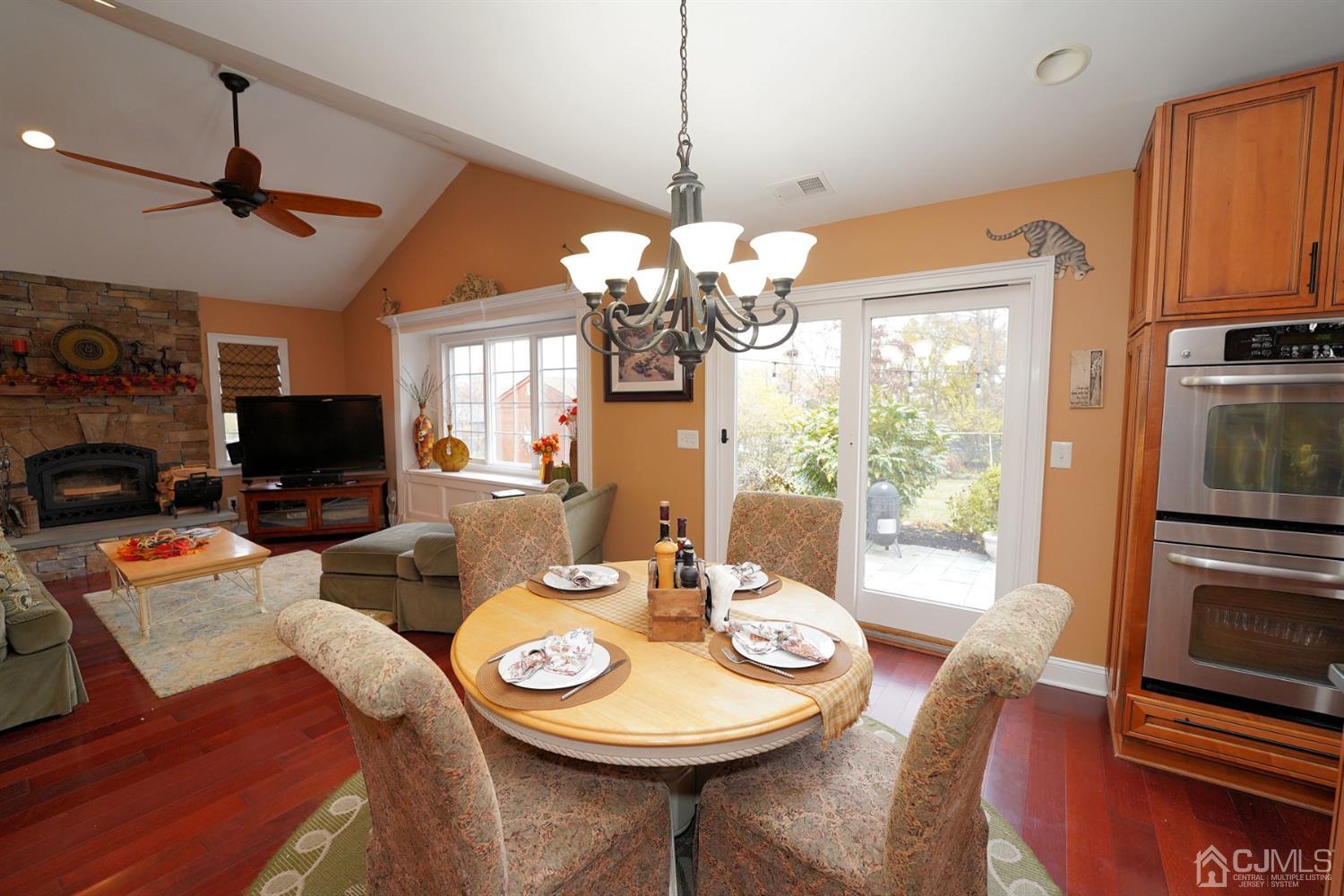 56 Kingsley Road Kendall Park, NJ 08824 - Photo 22 of 62 a view of a dining room with furniture window and wooden floor