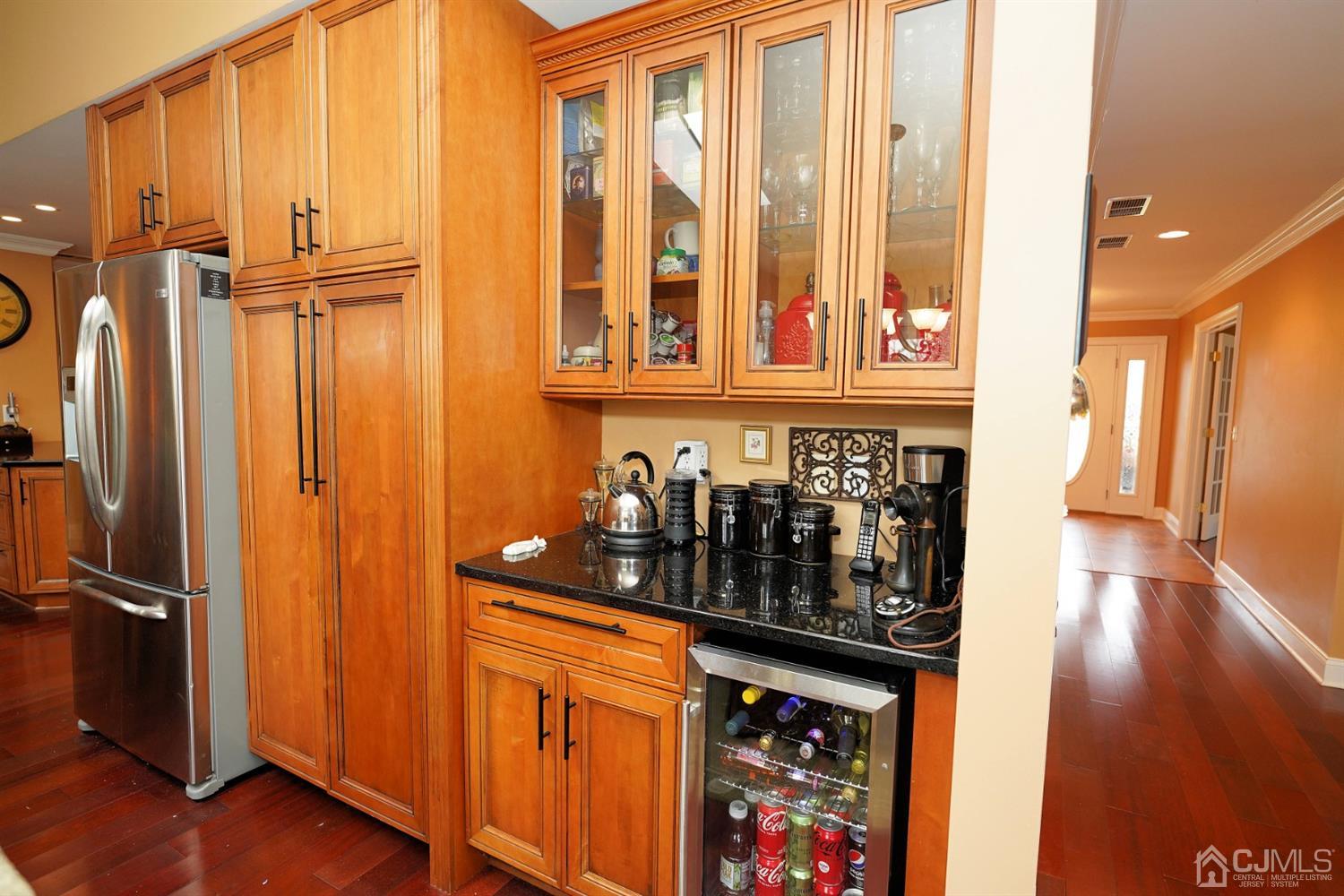 56 Kingsley Road Kendall Park, NJ 08824 - Photo 25 of 62 a view of a refrigerator and a window