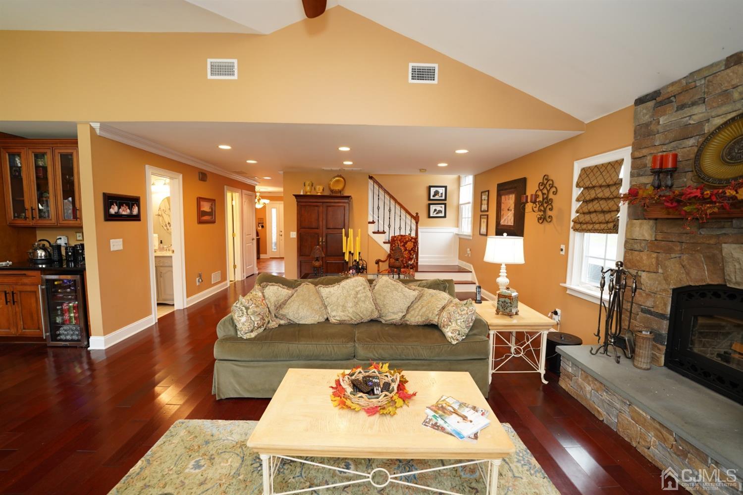 56 Kingsley Road Kendall Park, NJ 08824 - Photo 28 of 62 a living room with fireplace furniture and a flat screen tv