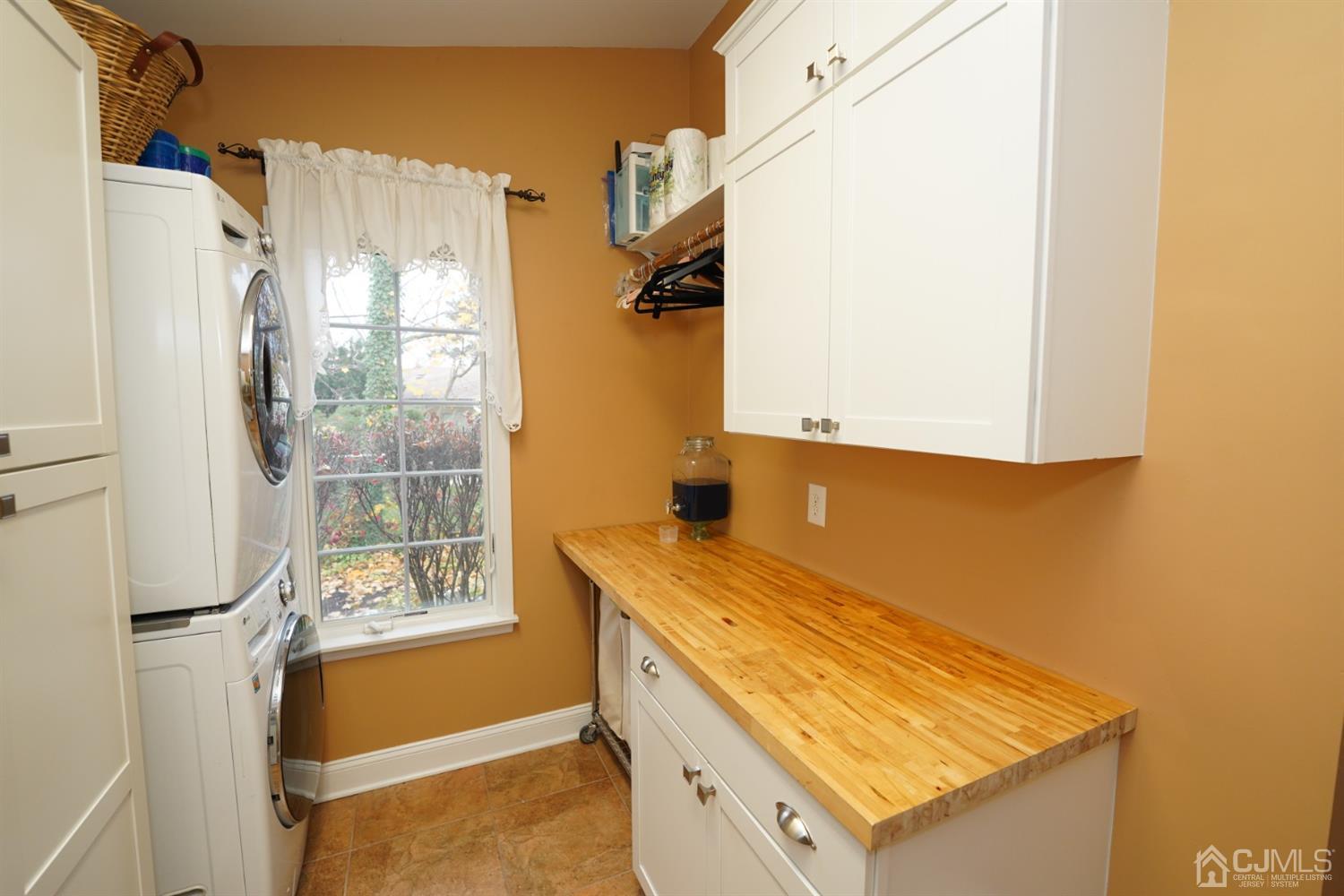 56 Kingsley Road Kendall Park, NJ 08824 - Photo 37 of 62 a view of a kitchen with a sink and a window